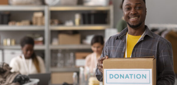 volunteer-helping-with-donation-box